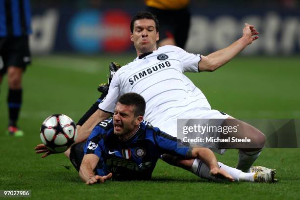Thiago Motta of Inter Milan is brought down by Michael Ballack of Chelsea during the UEFA Champions League Round of 16 first leg match between Inter...