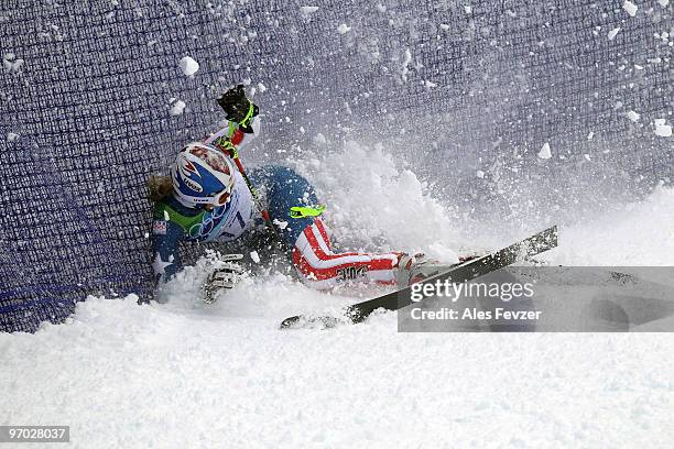 Lindsey Vonn of the United States crashes into the fence during the Ladies Giant Slalom first run on day 13 of the Vancouver 2010 Winter Olympics at...