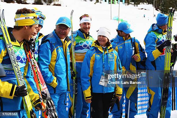 King Carl XVI Gustaf and Queen Silvia of Sweden congratulate Team Sweden, winners of the gold medal in the cross country skiing men's 4 x 10 km relay...