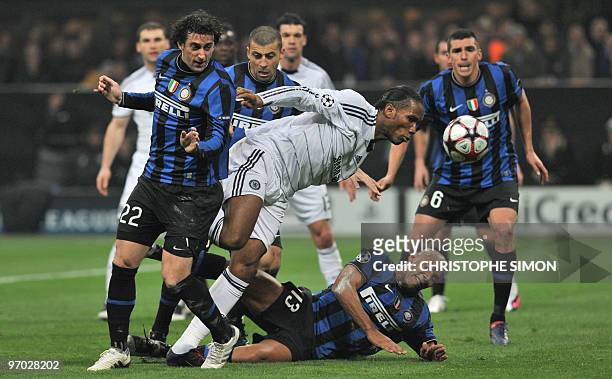 Chelsea's Ivorian striker Didier Drogba heads the ball past Inter Milan's Argentinian forward Alberto Milito Diego and Inter Milan's Brazilian...