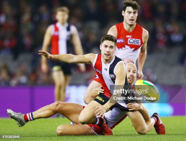 Jarrad McVeigh of the Swans tackles Jade Gresham of the Saints during the round 12 AFL match between the St Kilda Saints and the Sydney Swans at...