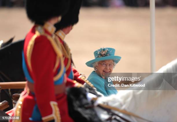 Queen Elizabeth II smiles at Prince William, Duke of Cambridge during Trooping The Colour ceremony at The Royal Horseguards on June 9, 2018 in...