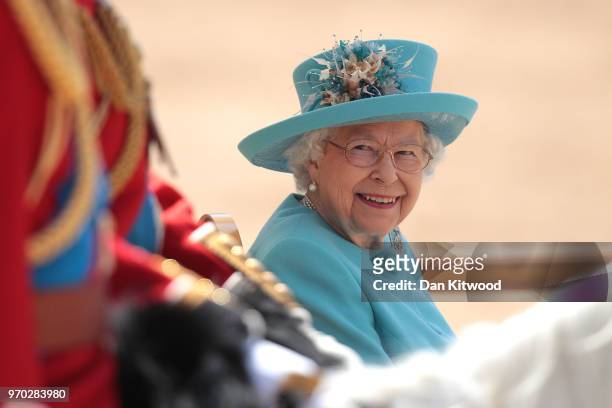 Queen Elizabeth II smiles at Prince William, Duke of Cambridge during Trooping The Colour ceremony at The Royal Horseguards on June 9, 2018 in...