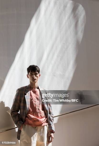 Model backstage at the E. Tautz presentation during London Fashion Week Men's June 2018 at the Congress Centre on June 9, 2018 in London, England.