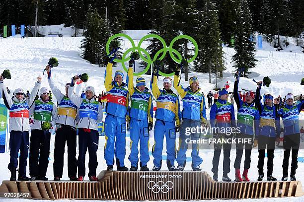 Sweden's gold medalist's Daniel Richardsson, Johan Olsson, Anders Soedergren and Marcus Hellnerin, Norway's silver medalists Norway's Martin Johnsrud...