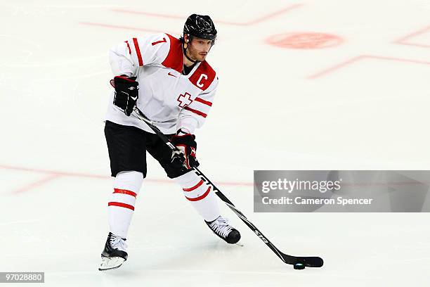 Mark Streit of Switzerland handles the puck during the ice hockey men's quarter final game between USA and Switzerland on day 13 of the Vancouver...