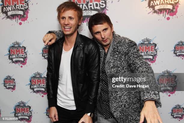 Dominic Howard and Matt Bellamy of Muse pose with their best British band award in front of the winners boards at the Shockwaves NME Awards 2010 held...