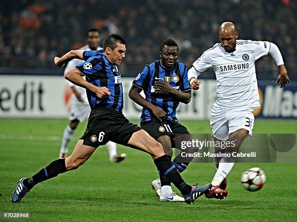 Lucio and Sulley Muntari of FC Inter Milan battles for the ball against Nicolas Anelka of Chelsea during the UEFA Champions League round of 16 first...