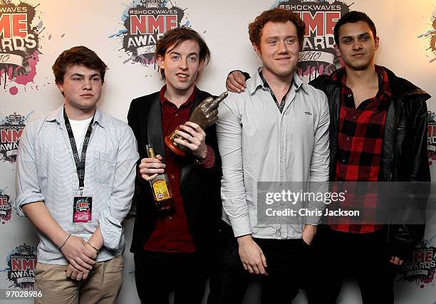 Jack Steadman, Jamie MacColl, Suren de Saram and Ed Nash of Bombay Bicycle pose with their best new band award in front of the winners boards at the...