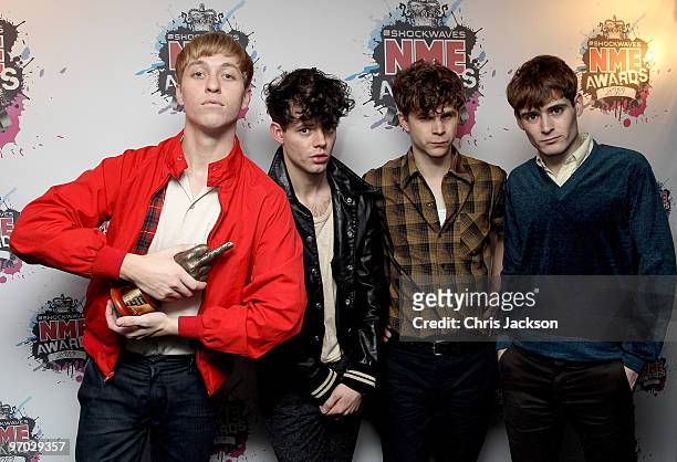 Jacob Graham, Connor Hanwick, Adam Kessler and Jonathon Pierce of The Drums pose back stage with the Philip Hall Radar Award in the Award Room at the...