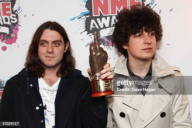 Jamie Cook and Matt Helders of The Arctic Monkeys pose with their best live band award in front of the winners boards at the Shockwaves NME Awards...