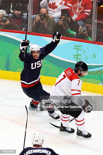 Zach Parise of the United States celebrate after a late goal in front of Mark Streit of Switzerland during ice hockey men's quarter final game...