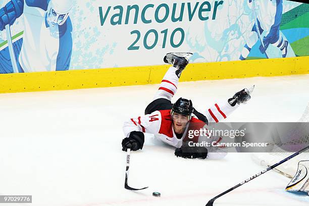 Roman Wick of Switzerland falls during the ice hockey men's quarter final game between USA and Switzerland on day 13 of the Vancouver 2010 Winter...