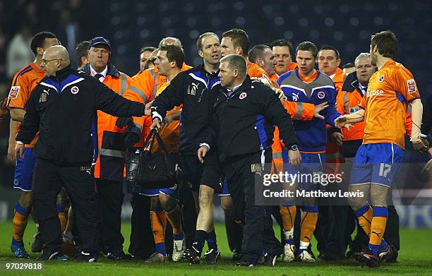 Nigel Gibbs of Reading is lead away after confronting a steward at the final whistle during the FA Cup sponsored by E.on 5th Round Replay match...