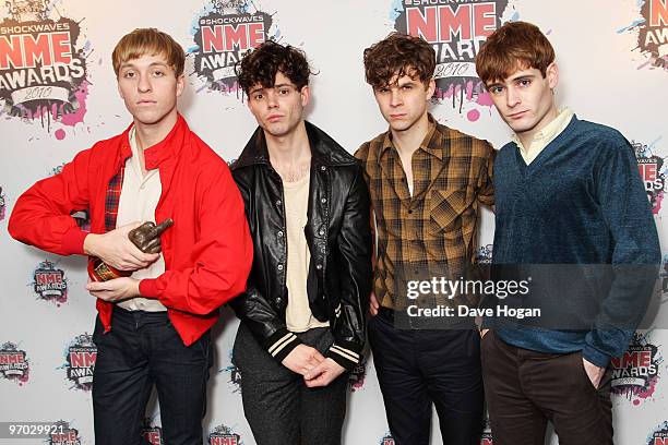 Jacob Graham, Connor Hanwick, Adam Kessler and Jonathon Pierce of The Drums pose with the Phillip Hall radar award in front of the winners boards at...