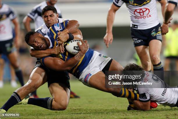 Siosaia Vave of the Eels is tackled during the round 14 NRL match between the Parramatta Eels and the North Queensland Cowboys at TIO Stadium on June...