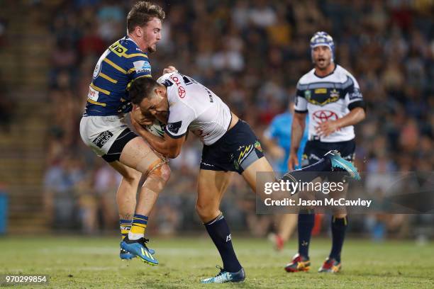 Antonio Winterstein of the Cowboys is tackled by Clint Gutherson of the Eels during the round 14 NRL match between the Parramatta Eels and the North...