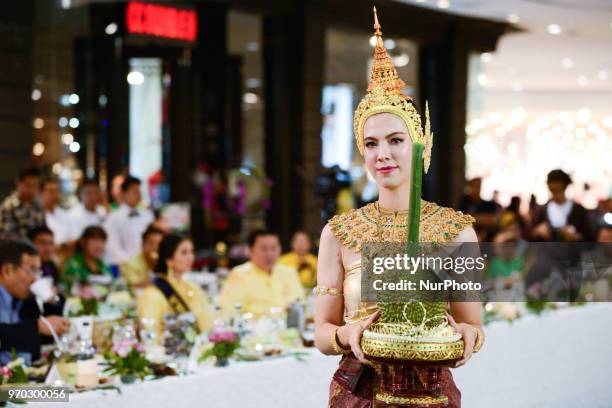 Model shows one of the most expensive kanyao durian auctioned off for 800,000 baht at the Durian Fair at department store in Nonthaburi province,...