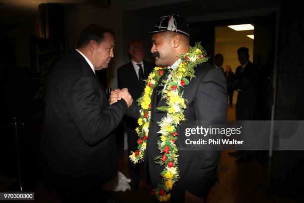 Karl Tu'inukuafe of the New Zealand All Blacks shakes hands with coach Steve Hansen at a capping ceremony following the International Test match...