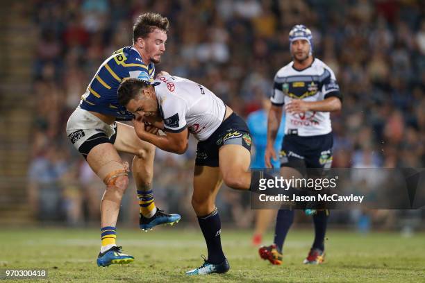 Antonio Winterstein of the Cowboys is tackled by Clint Gutherson of the Eels during the round 14 NRL match between the Parramatta Eels and the North...