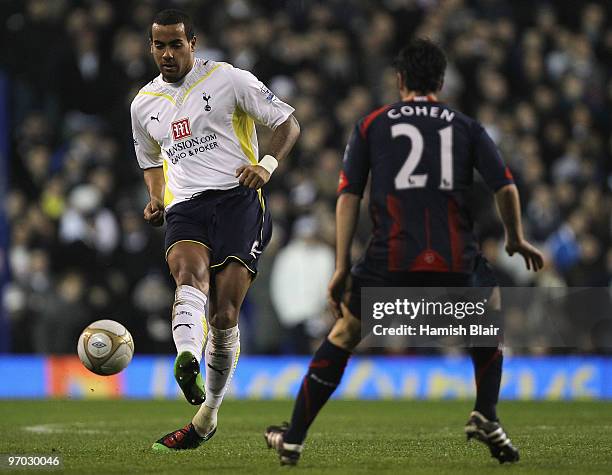 Tom Huddlestone of Tottenham passes around Tamir Cohen of Bolton during the FA Cup sponsored by E.ON 5th round replay match between Tottenham Hotspur...