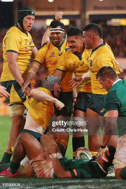 David Pocock of the Wallabies celebrates a try during the International Test match between the Australian Wallabies and Ireland at Suncorp Stadium on...