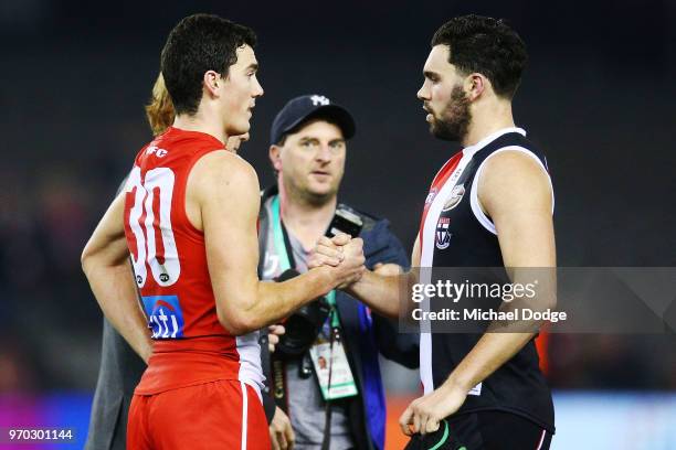 Brothers Tom McCartin of the Swans and defeates Paddy McCartin of the Saints shake hands during the round 12 AFL match between the St Kilda Saints...