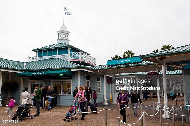 Guests exit the park at the end of the day at SeaWorld February 24, 2010 in Orlando, Florida. A female trainer who presumably slipped and fell in to...