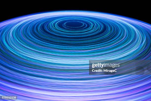 blue colored light trail spinning - data vortex stock pictures, royalty-free photos & images