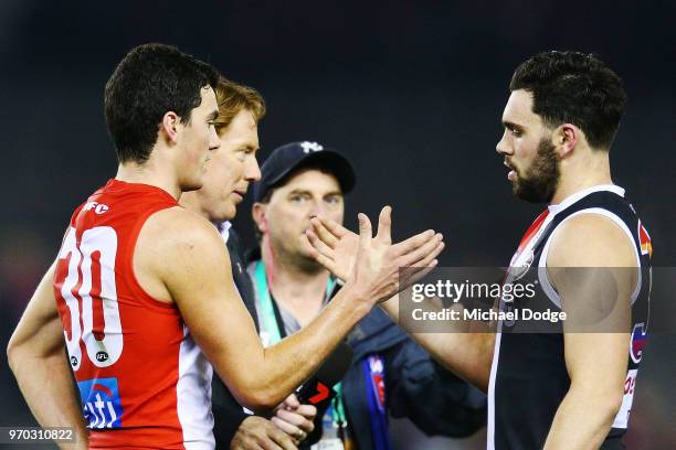 Brothers Tom McCartin of the Swans and defeates Paddy McCartin of the Saints shake hands during the round 12 AFL match between the St Kilda Saints...