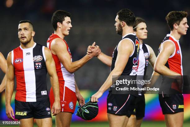 Brothers Tom McCartin of the Swans and defeates Paddy McCartin of the Saints shake hands during the round 12 AFL match between the St Kilda Saints...