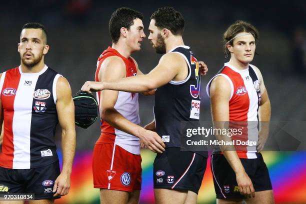 Brothers Tom McCartin of the Swans and defeates Paddy McCartin of the Saints hug during the round 12 AFL match between the St Kilda Saints and the...