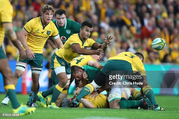 Will Genia of the Wallabies passes during the International Test match between the Australian Wallabies and Ireland at Suncorp Stadium on June 9,...