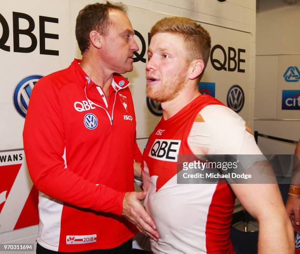 Swans head coach John Longmire with Daniel Hannebery of the Swans during the round 12 AFL match between the St Kilda Saints and the Sydney Swans at...