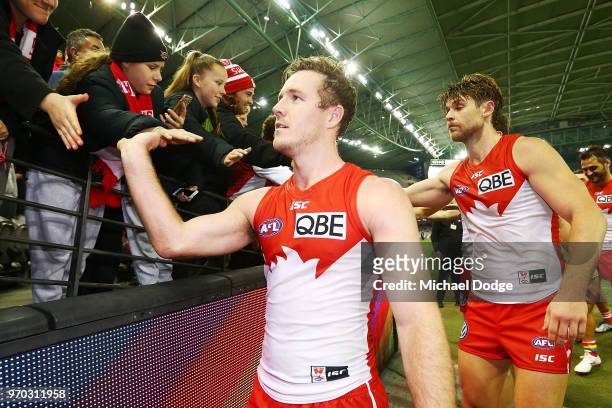 Luke Parker of the Swans celebrates the win with fans during the round 12 AFL match between the St Kilda Saints and the Sydney Swans at Etihad...