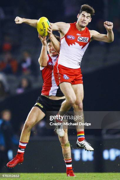 George Hewett of the Swans spoils Josh Battle of the Saints during the round 12 AFL match between the St Kilda Saints and the Sydney Swans at Etihad...