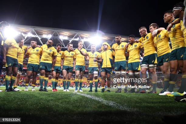 Will Genia of the Wallabies speaks to his team in a huddle after victory during the International Test match between the Australian Wallabies and...