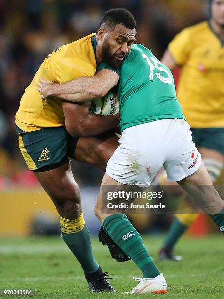 Samu Kerevi of the Wallabies is tackled during the International Test match between the Australian Wallabies and Ireland at Suncorp Stadium on June...