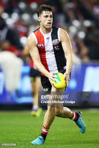 Jack Steele of the Saints looks upfield during the round 12 AFL match between the St Kilda Saints and the Sydney Swans at Etihad Stadium on June 9,...