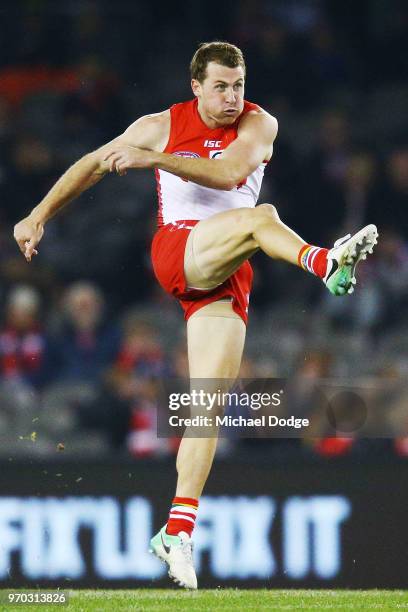 Harry Cunningham of the Swans kicks the ball during the round 12 AFL match between the St Kilda Saints and the Sydney Swans at Etihad Stadium on June...