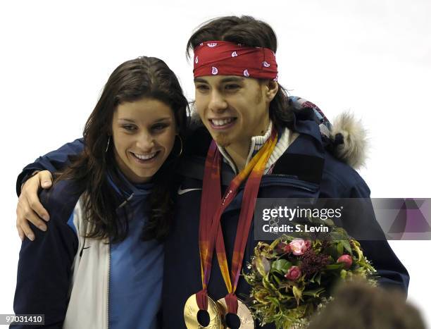 Apolo Anton Ohno's teammate, US Speedskater Allison Baver enjoys the moment with Ohno during the Short Track Speed Skating 500 m at the 2006 Olympic...