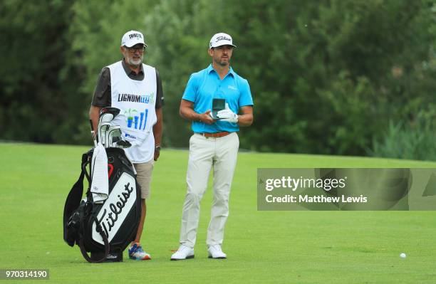 Wade Ormsby of Australia and his caddie look on from the 4th hole during day three of the 2018 Shot Clock Masters at Diamond Country Club on June 9,...