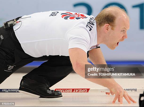 Britain's Ewan MacDonald shouts the direction during the Vancouver Winter Olympic men's curling tie-breaker match against Sweden at the Vancouver...