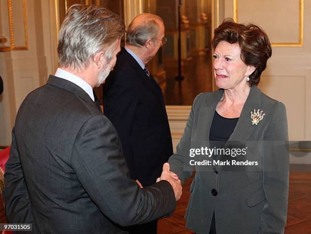 Prince Philippe of Belgium shakes hands with Vice President of the EC Neelie Kroes during a reception for the European Authorities at the Royal...