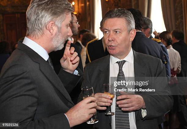 Prince Philippe of Belgium and Member of the European Commission Karel De Gucht talk during a reception for the European Authorities at the Royal...