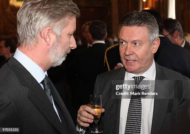 Prince Philippe of Belgium and Member of the European Commission Karel De Gucht talk during a reception for the European Authorities at the Royal...