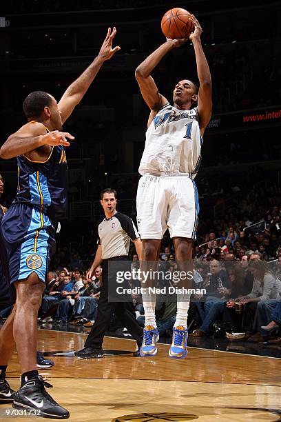 Nick Young of the Washington Wizards shoots against Malik Allen of the Denver Nuggets during the game on February 19, 2010 at the Verizon Center in...