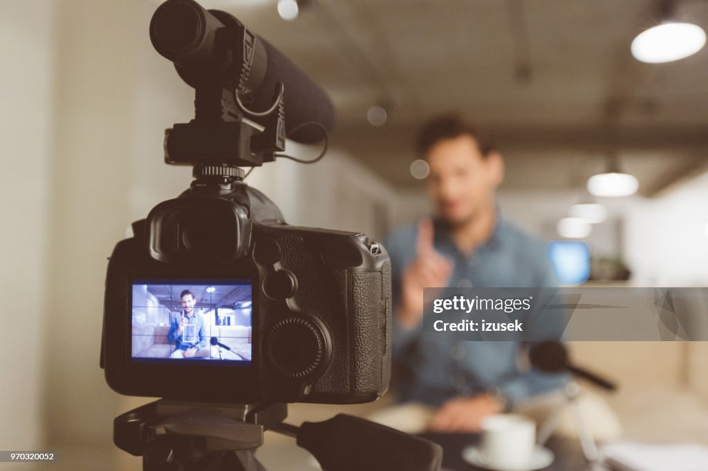 Male vlogger recording content for his vlog