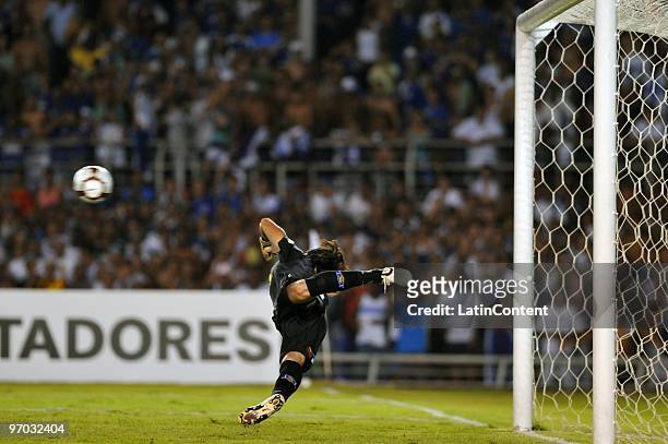 Goalkeeper Francisco Prieto of Colo Colo tries to defend a penalty kicked by Kleber of Cruzeiro during their soccer match as part of 2010...