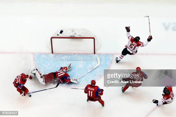 Rick Nash of Canada celebrates with his team after scoring past Evgeny Nabokov of Russia during the ice hockey men's quarter final game between...